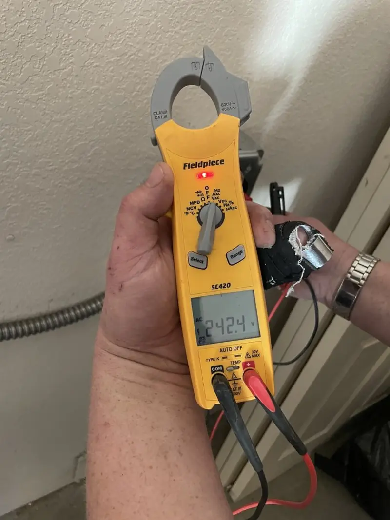 Voltage testing with clamp meter during Generator Installation in Atherton